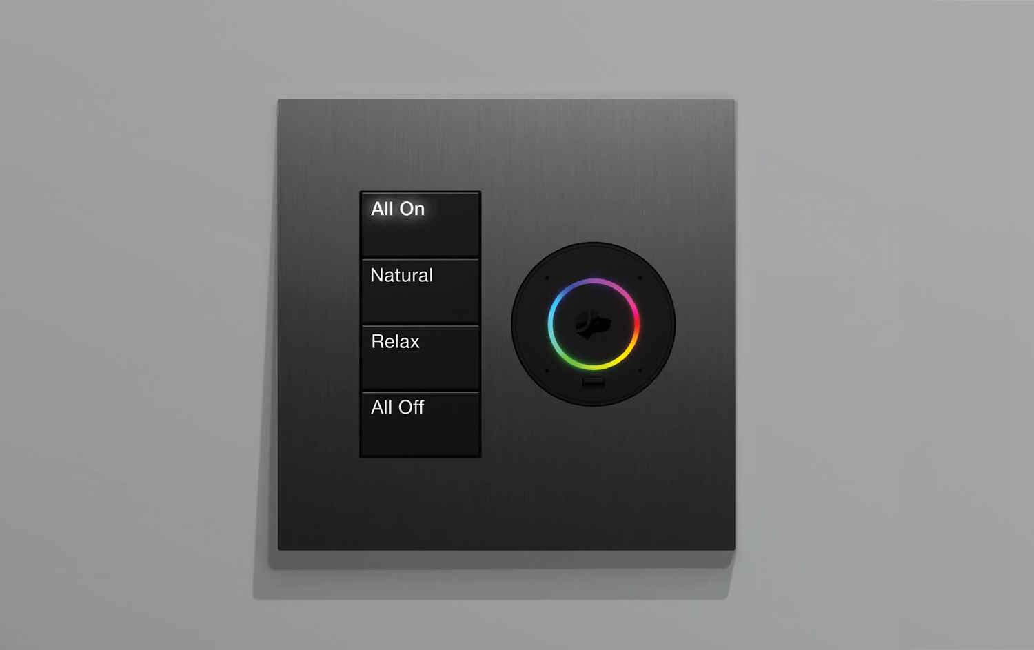 Modern wall-mounted smart lighting control panel with four labeled buttons and a circular color selector.