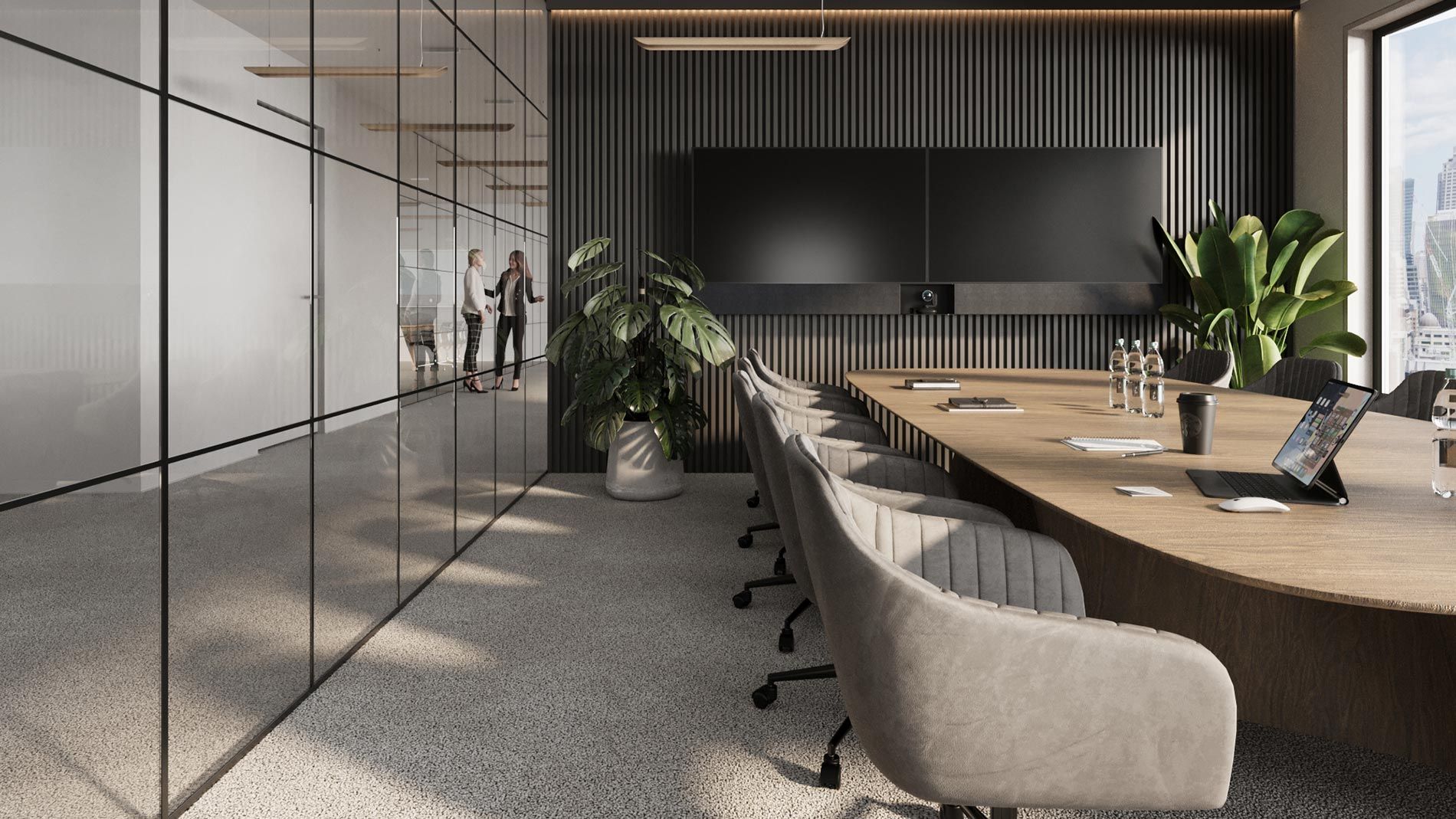 Modern conference room with a large table, chairs, and dual screens mounted on a dark wall.